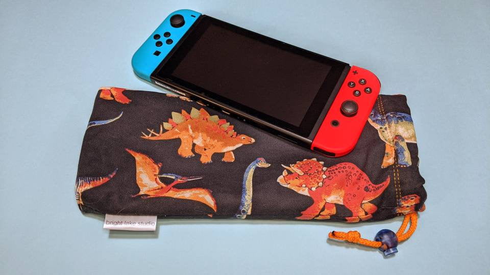 sandhed Åbent sweater Nintendo Switch Sleeve | Dinosaurs – Bright Lake Studio